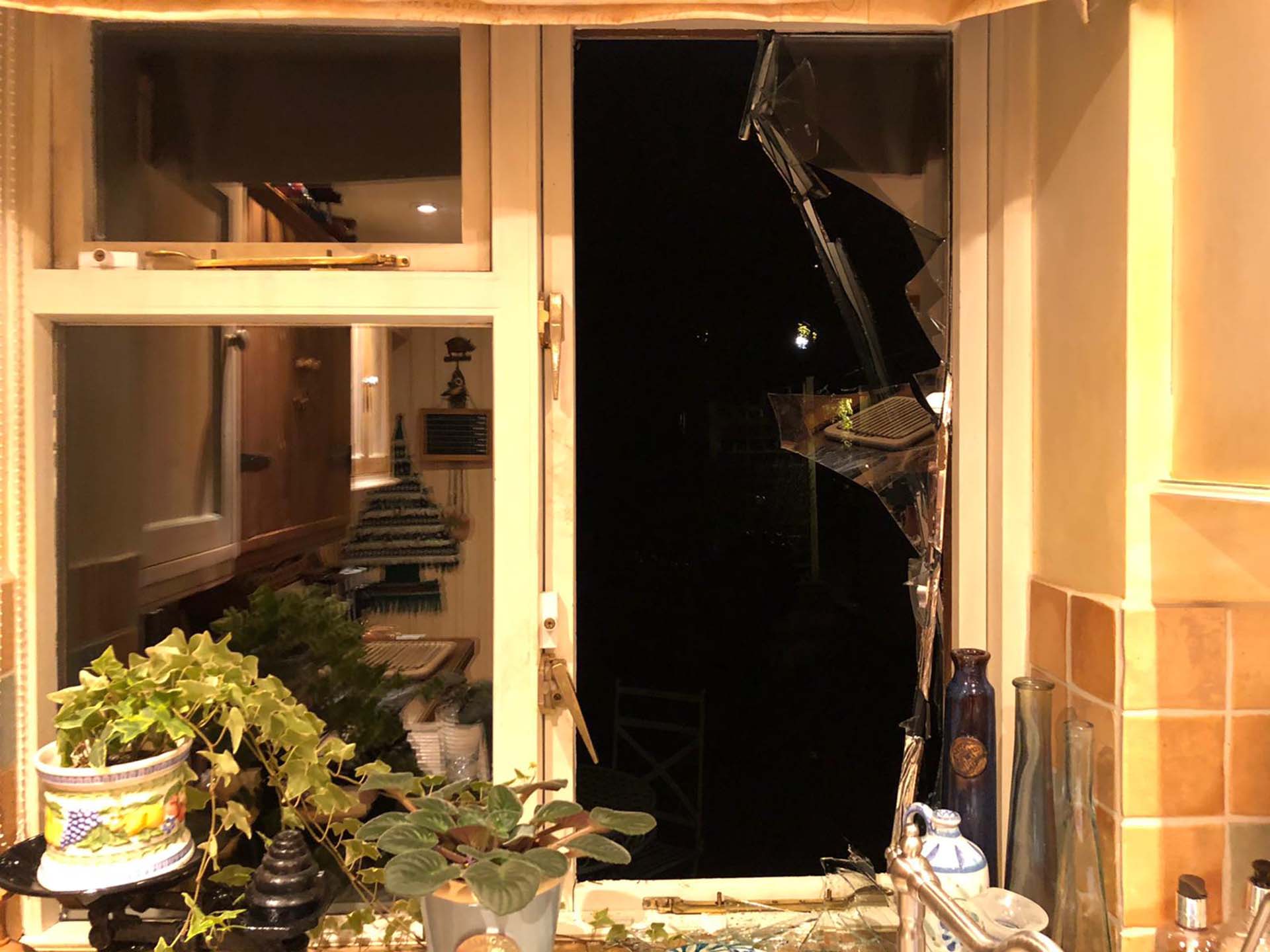 Smashed apartment window. 